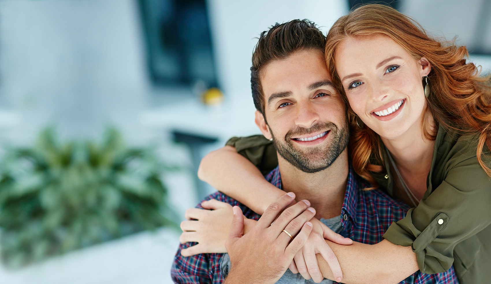 young happy couple embracing, dentist in haymarket